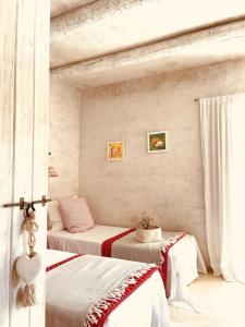 a bedroom with two beds in a room at Casa Matelito in Playa Migjorn +18 photos