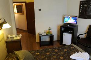 A television and/or entertainment center at Megara Palace - Old City