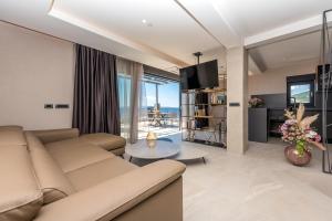 a living room with a couch and a table at Vila Aurelia 2 in Makarska