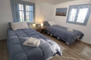 Voodi või voodid majutusasutuse Beachfront 2Br Garden Bbq SeaView QuietRetreat toas