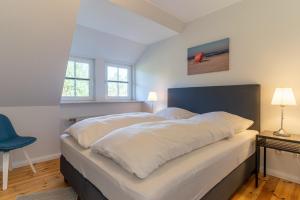 Voodi või voodid majutusasutuse Hus Dünenkieker SPO Hus Dünenkieker SPO toas