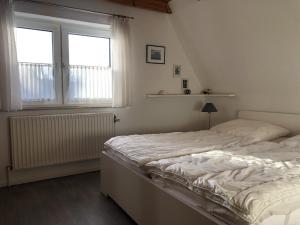 Postel nebo postele na pokoji v ubytování Blaue Oase Ferienhaus + 12 fotografií
