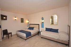RIAD Comfort Rooms客房内的一张或多张床位