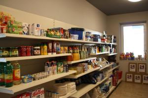 a store aisle with shelves filled with food at Seestübchen am Herthasee in Hörstel +35 photos