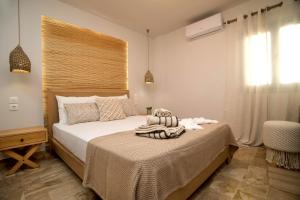 Ein Bett oder Betten in einem Zimmer der Unterkunft Horizon Hotel Kalymnos