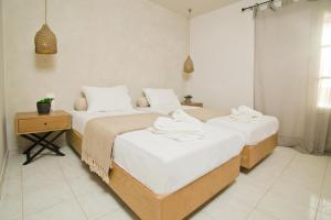 Ein Bett oder Betten in einem Zimmer der Unterkunft Horizon Hotel Kalymnos