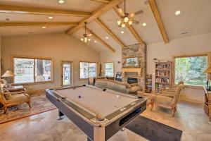 a living room with a pool table at High-End Huntsville Condo with Private Hot Tub! in Huntsville