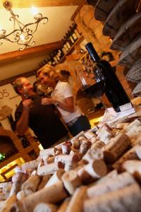 a group of people standing in a room with wine bottles at Gasthof-Pension Weninger in Paldau +8 photos
