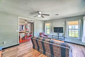 a living room with a couch and a flat screen tv at Centrally Located Lawton Home Dogs Welcome! in Lawton
