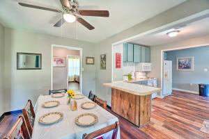 a kitchen and dining room with a table and a ceiling fan at Centrally Located Lawton Home Dogs Welcome! in Lawton