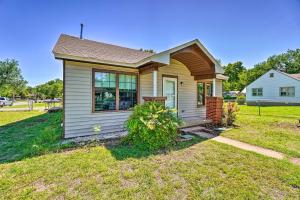 a small house in a field with a yard at Centrally Located Lawton Home Dogs Welcome! in Lawton