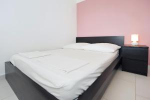 Postel nebo postele na pokoji v ubytování Apartmani Dragičević