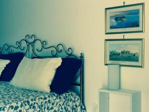 Posteľ alebo postele v izbe v ubytovaní Caio Asinio Apartment