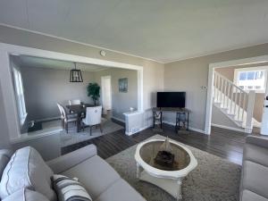 a living room with a couch and a table at 3 Bedroom House with Lake Pepin views with access to shared pool in Lake City