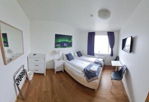 Postel nebo postele na pokoji v ubytování Höfn Guesthouse