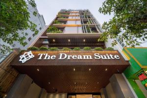 a building with a sign that reads the dream suite at The Dream Suite in Da Nang