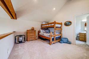 a bedroom with a bunk bed and a sink at Ocean Song in Shelter Cove