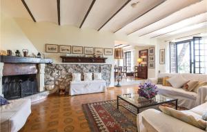 a large living room with a stone fireplace at Il Seminario in Collevecchio