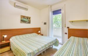En eller flere senge i et værelse på Ai Pini-Residence