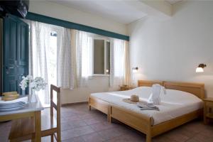 Postel nebo postele na pokoji v ubytování Rose Bay Hotel + 36 fotografií