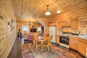 a kitchen and dining room with a table and chairs at Rural Manistique Home Yard, Near Boat Launch in Manistique
