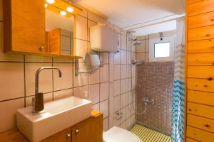 a bathroom with a sink and a shower at [kritsa house] in Kritsá