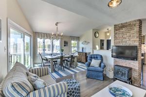 a living room with a couch and a fireplace at Westbrook Home with Ocean Views - Walk to Beach in Westbrook