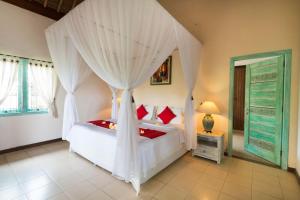 Ein Bett oder Betten in einem Zimmer der Unterkunft Umasari Rice Terrace Villa by AGATA