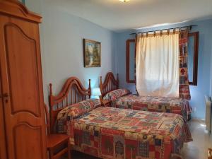 A bed or beds in a room at Apartamento Casa Go