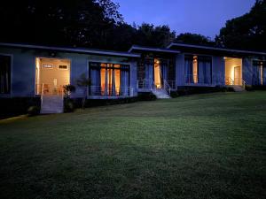a house with its lights on at night at YerbaBuena Lodge in Monteverde Costa Rica
