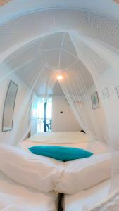 a white bed with a canopy in a room at Gafitas in Playa Blanca