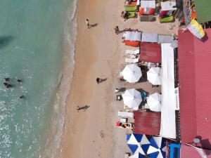 an overhead view of a beach with umbrellas at Gafitas in Playa Blanca