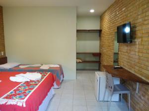 Postelja oz. postelje v sobi nastanitve Hotel Pousada Porto do Colibri