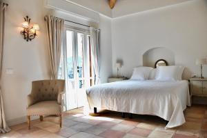 A bed or beds in a room at Apricus Locanda Boutique Hotel