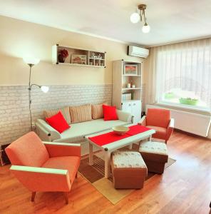 a living room with a couch and a table at Дом Анести in Varna City