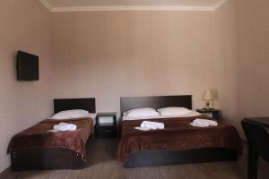 Postel nebo postele na pokoji v ubytování Hotel Rabati + 37 fotografií
