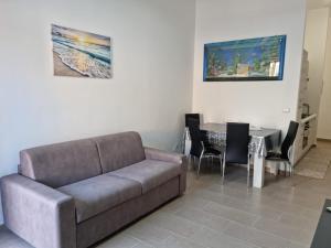 a living room with a couch and a table at Appartamenti a Gallipoli in Gallipoli