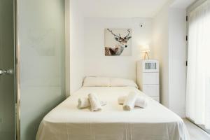 A bed or beds in a room at Empecinado Még 26 kép