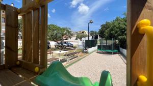 a view of a playground from a window at House Roca in Vodice
