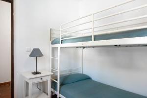 Postel nebo postele na pokoji v ubytování Poniente