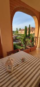 a room with a table with a view of a balcony at La Casa Di Irene in Riotorto