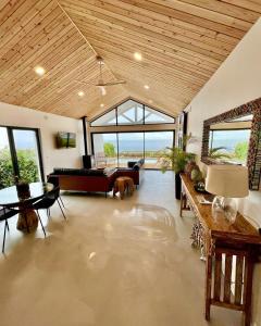 a large living room with a couch and a table at Sul Villas & Spa - Azores in Lagoa