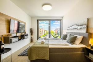 Posteľ alebo postele v izbe v ubytovaní MyFlat Coral Premium Suite + 31 fotografií