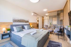 Posteľ alebo postele v izbe v ubytovaní MyFlat Coral Premium Suite