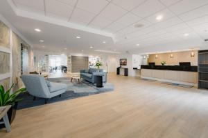 an office lobby with chairs and a reception desk at Hotel Bethany Beach in Bethany Beach