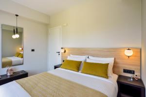 Postel nebo postele na pokoji v ubytování Dandelion apartments
