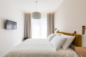 Postel nebo postele na pokoji v ubytování Villa Scala