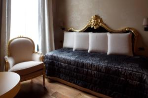 Gulta vai gultas numurā naktsmītnē Hotel Cà Zusto Venezia