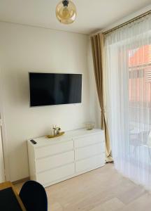 Televisyen dan/atau pusat hiburan di Apartamentai “Viola” Juodkranteje +14 gambar