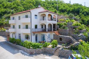 a house on the side of a mountain at Dora Apartment-Adults Only in Senj